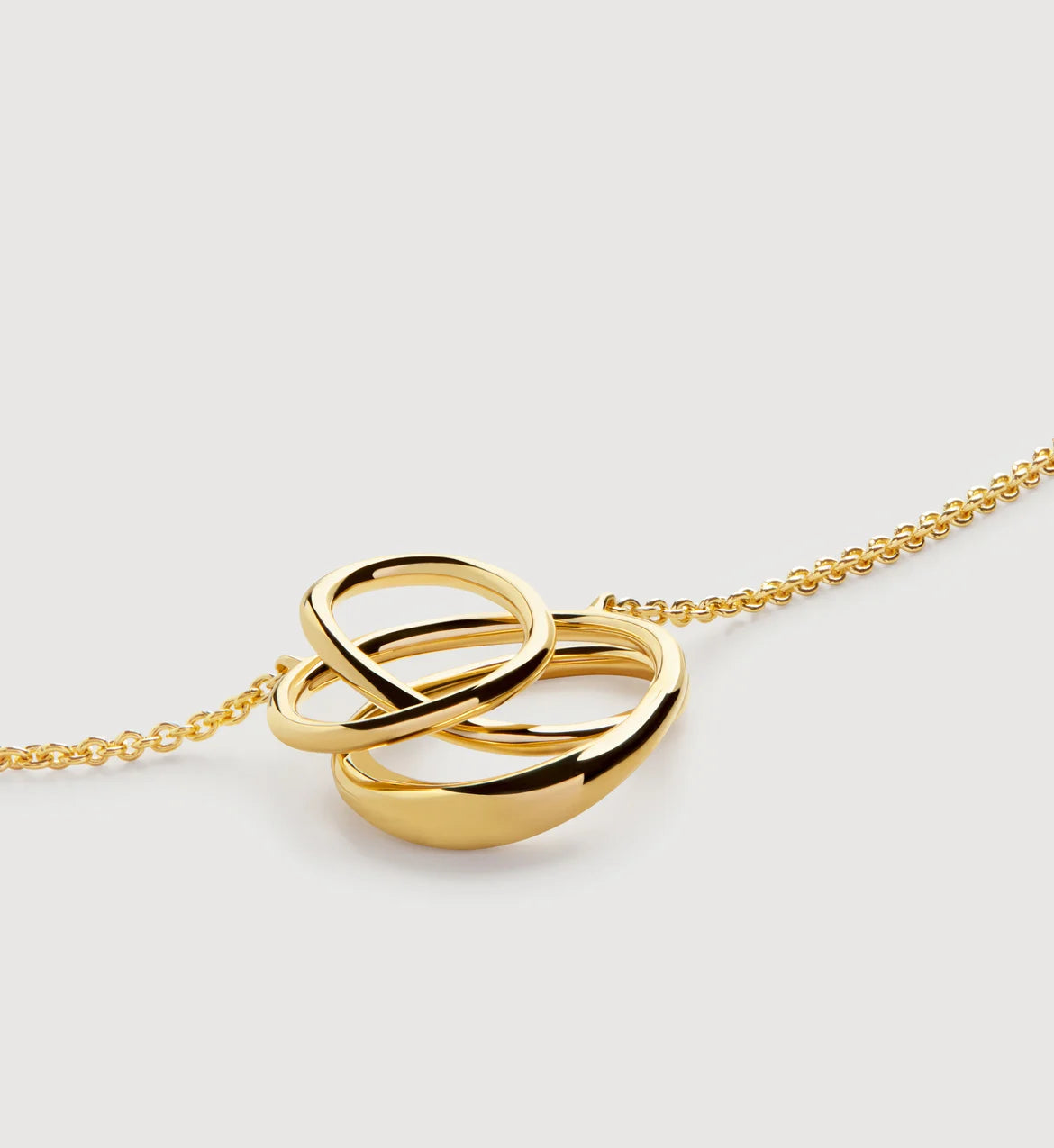 Infinite gold pendant