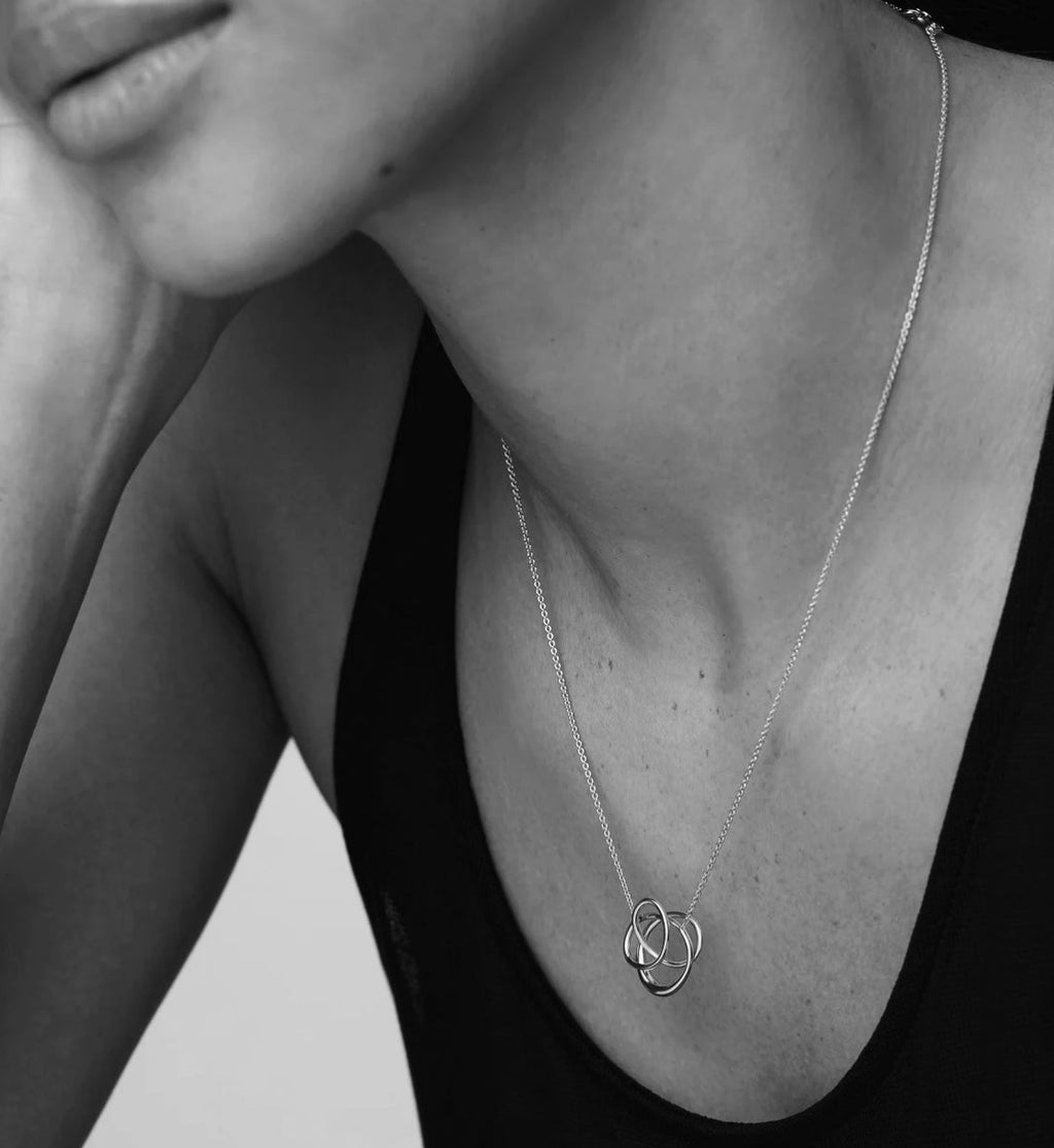 Infinite gold pendant