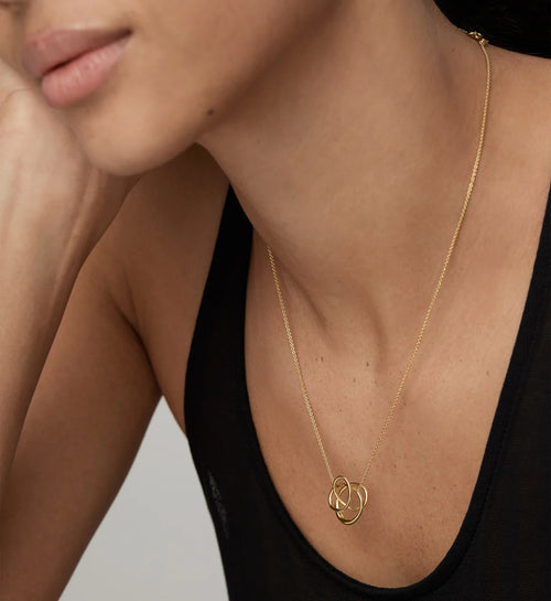 Infinite gold pendant